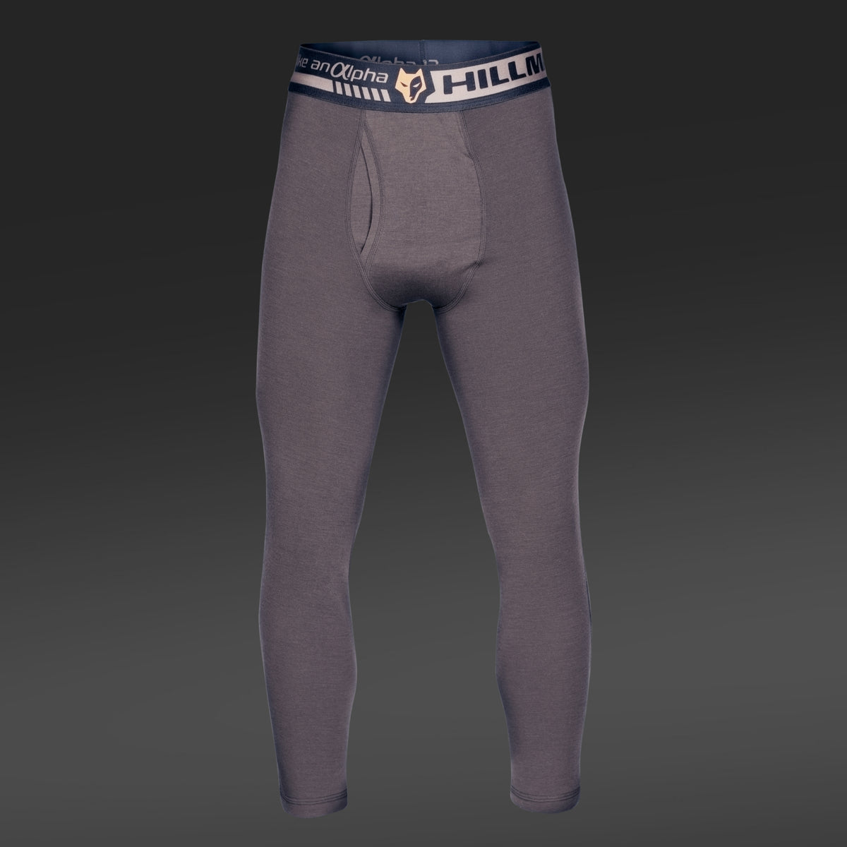 Graue Kompressionsleggings mit schwarz-weißem „Hillman“-Bund aus wärmender Merinowolle. Die Vorderansicht mit dunklem Farbverlauf betont die dezente Konturierung für eine perfekte anatomische Passform. Produkt: 2BL Merino Lange Unterhose – Merino Thermounterwäsche für die Jagd.