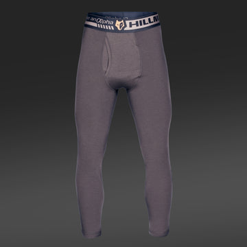 Graue Kompressionsleggings mit schwarz-weißem „Hillman“-Bund aus wärmender Merinowolle. Die Vorderansicht mit dunklem Farbverlauf betont die dezente Konturierung für eine perfekte anatomische Passform. Produkt: 2BL Merino Lange Unterhose – Merino Thermounterwäsche für die Jagd.